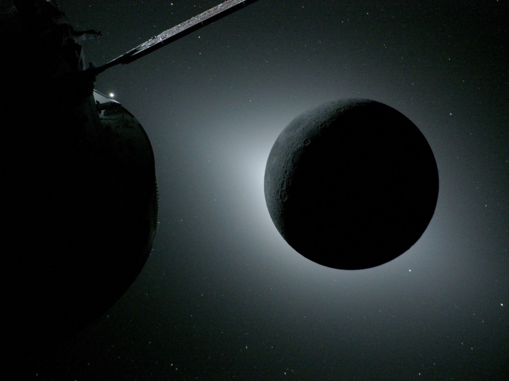 Photo by HANDOUT / NASA / AFP  This handout picture released by NASA on April 7, 2026, shows the Orion spacecraft (L) and the Moon backlit by the Sun during a solar eclipse on April 6, 2026.
