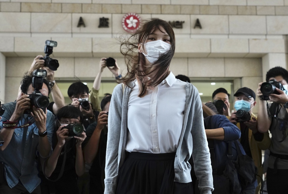 Agnes Chow – seen before her trial on November 23 and being escorted to court yesterday, below – received 10 months. Ivan Lam, near right, and Joshua Wong return to jail after the sentencing. ap, sING TAO Agnes Chow – seen before her trial on November 23 and being escorted to court yesterday, below – received 10 months. Ivan Lam, near right, and Joshua Wong return to jail after the sentencing. ap, sING TAO