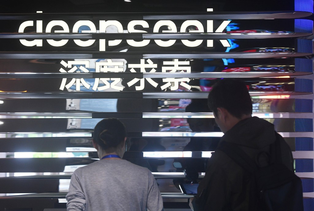 People learn about AI model DeepSeek at a fair themed on AI technologies in Hangzhou, east China's Zhejiang Province, May 4, 2025. (Photo by Long Wei/Xinhua)