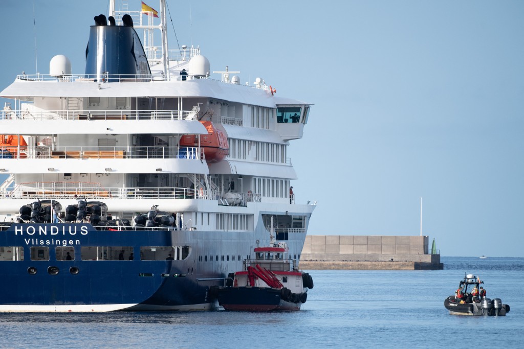 Boats approach the Dutch flagged hantavirus-stricken cruise ship MV Hondius after it arrived at the industrial port of Granadilla de Abona on the island of Tenerife in Spain's Canary Islands on May 10, 2026 (AFP)