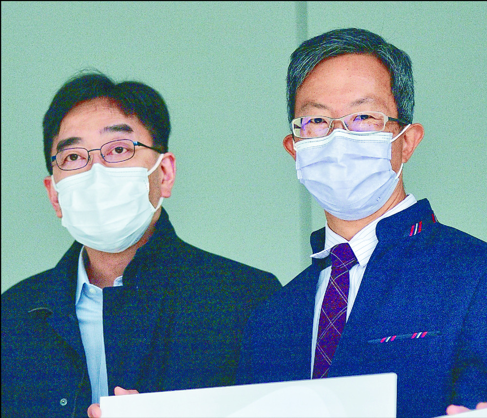 David Lam, right, with Ko Wing-man. David Lam, right, with Ko Wing-man.