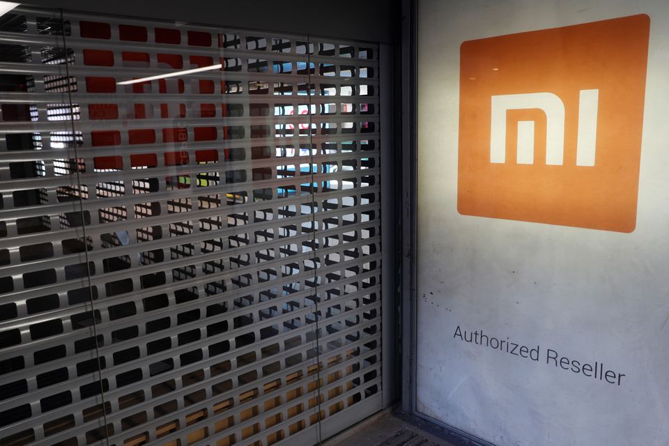 Xiaomi logo on a store which closed during a lockdown, imposed to prevent the spread of coronavirus disease, in central Kiev, Ukraine April 2, 2020. Xiaomi logo on a store which closed during a lockdown, imposed to prevent the spread of coronavirus disease, in central Kiev, Ukraine April 2, 2020.