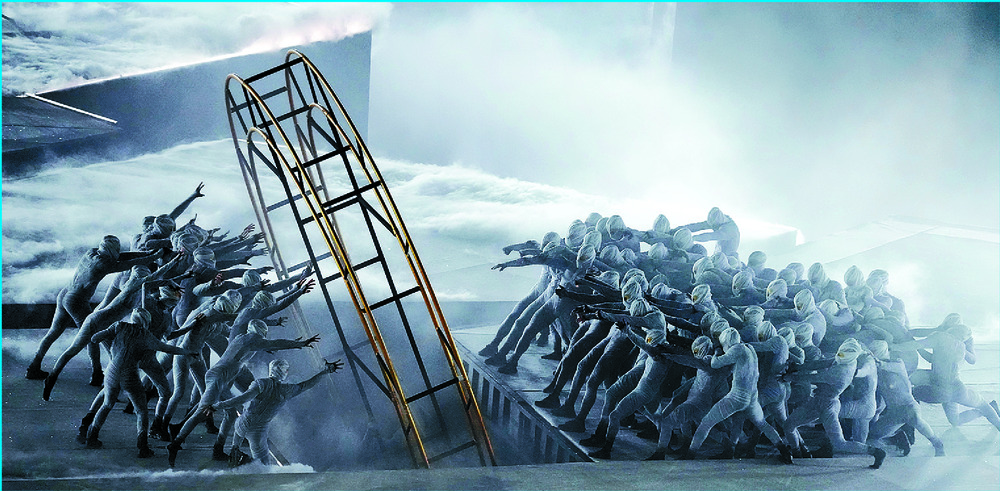 Artists perform during the closing ceremony while athletes swarm the stage during the set of indie rock band Phoenix. XINHUA, REUTERS