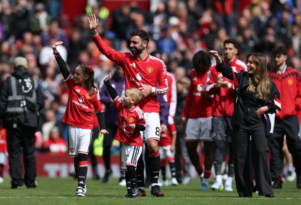 Bruno Fernandes with his wife Ana Pinho and their children Matilde and Goncalo at the end of the match at Old Trafford. REUTERS