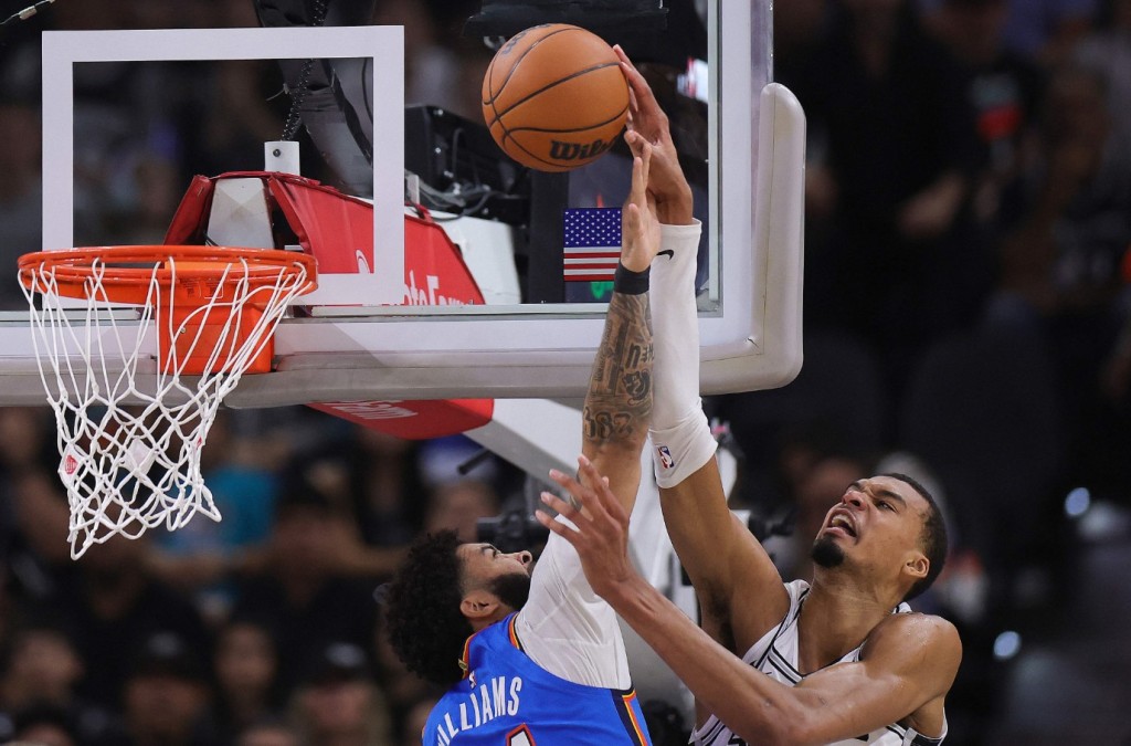 Victor Wembanyama is fouled by Kenrich Williams of the Oklahoma City Thunder. AFP
