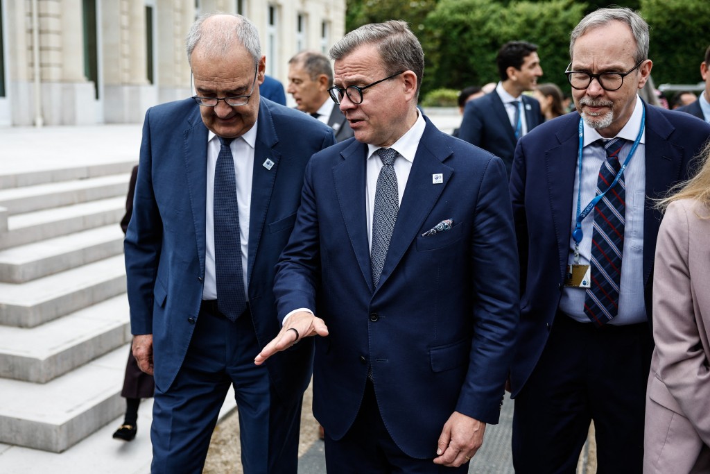 Finland's Prime Minister Petteri Orpo (C) chats with attendees at the OECD 2026 Ministerial Council Meeting (MCM) at the Organisation for Economic Co-operation and Development (OECD) headquarters in Paris on June 3, 2026. (Photo by SIMON WOHLFAHRT / AFP)