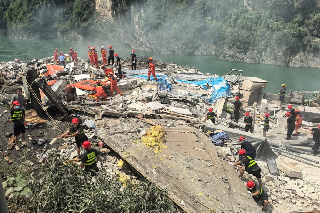 Rescue workers search for survivors at the site of a landslide along Wujiang river in Pengshui Miao and Tujia Autonomous County, Chongqing, China July 17, 2026. cnsphoto via REUTERS