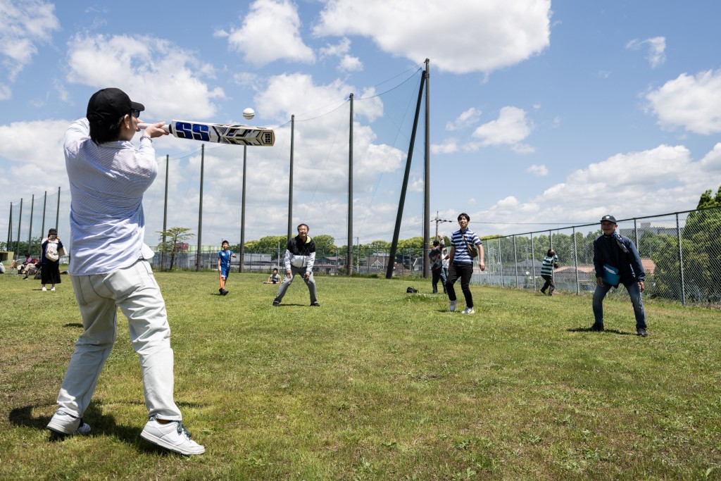 Photo by ANDREW CABALLERO-REYNOLDS / AFP In this photo taken on May 9, 2026, a spectator hits a ball on the sidelines during a break in play during the ICC T20 World Cup East Asia-Pacific Qualifier match between Japan and Vanuatu at the Nisshin Cricket Ground at Korogi Sports Park in Nisshin, Aichi Prefecture.