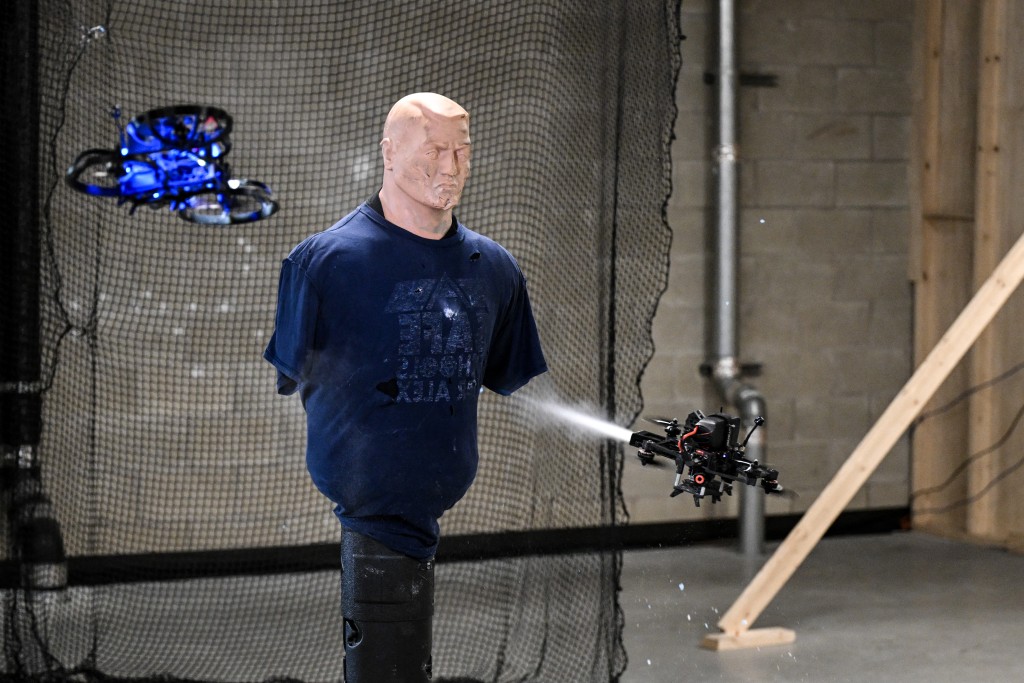 A drone fires inert gas at a mannequin, during a demonstration on how to neutralize a shooter in a school, held at the headquarters of the startup “Campus Guardian Angel” on May 8, 2026, in Austin, Texas. (Photo by RONALDO SCHEMIDT / AFP)