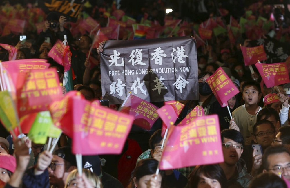 Supporters of DPP waved flags with Hong Kong protest slogans. Photo: AP