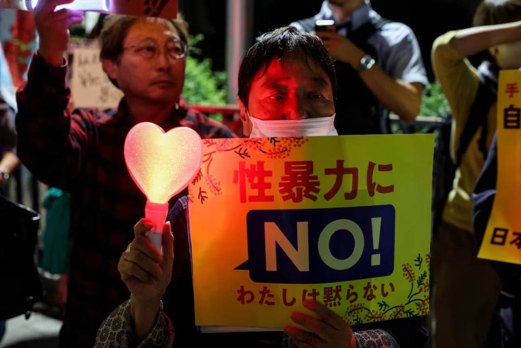 A demonstrator holds a placard during a protest outside the Prime Minister's office following the killing of a Japanese woman in Okinawa, for which a US Marine is a suspect, in Tokyo, Japan, October 5, 2026. The placard reads: "No to sexual violence". REUTERS/Kim Kyung-Hoon