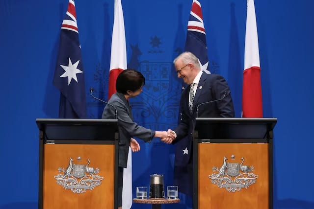 Japan's Prime Minister Sanae Takaichi shakes hands with Australia's Prime Minister Anthony Albanese during a press conference at Parliament House in Canberra, Australia, May 4, 2026. REUTERS/Hollie Adams 