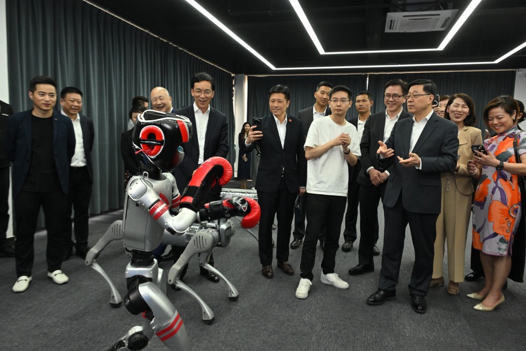 John Lee watches boxing robot demonstration at Unitree Robotics in Hangzhou (John Lee's Facebook)