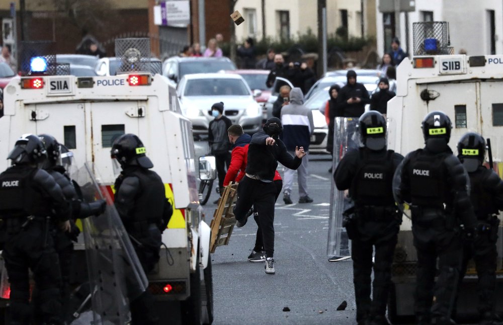 Nationalists from the mainly Catholic Springfield road area of West Belfast clash with police in Northern Ireland, Wednesday, April 7, 2021. The police had to close roads into the near by Protestant area as crowds from each divide attacked each other. Nationalists from the mainly Catholic Springfield road area of West Belfast clash with police in Northern Ireland, Wednesday, April 7, 2021. The police had to close roads into the near by Protestant area as crowds from each divide attacked each other.