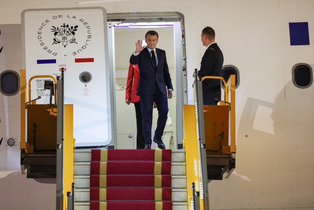 France's President Emmanuel Macron gestures upon his arrival at Noi Bai International Airport, marking the first trip to Vietnam by a French president in nearly a decade, in Hanoi, Vietnam, May 25, 2025. (Reuters)