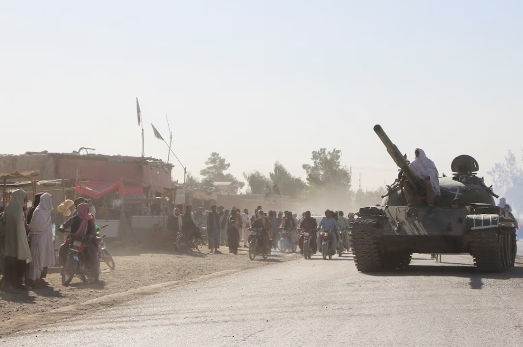 An Afghan Taliban fighter sits on a tank near the Afghanistan-Pakistan border in Spin Boldak, Kandahar Province, following exchanges of fire between Pakistani and Afghan forces in Afghanistan, October 15, 2025. REUTERS/Stringer
