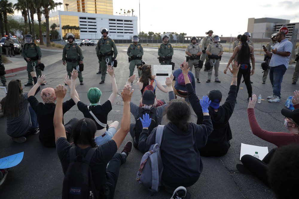 Protesters rally at Trump International Hotel Las Vegas, Monday, June 1, in Las Vegas, 