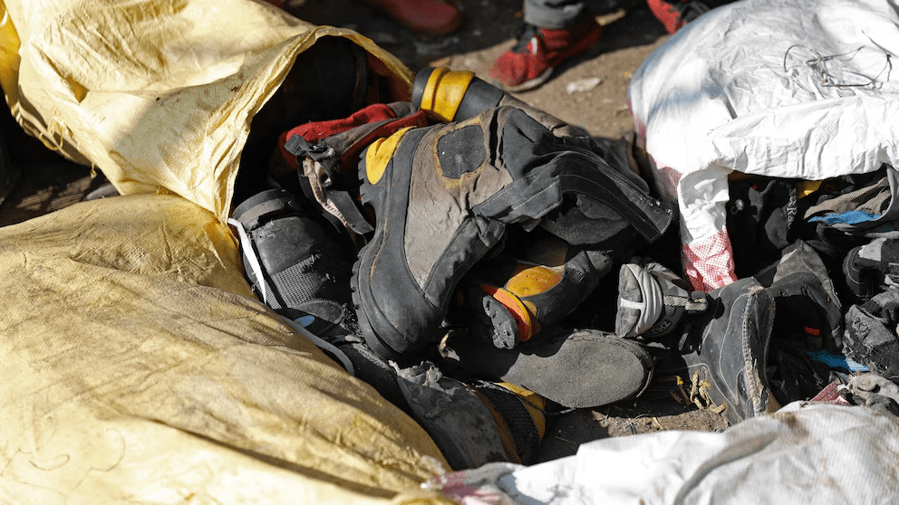 Shoes and other garbage collected en route Mount Everest is piled before it is sorted for recycling at a facility operated by Agni Ventures, an agency that manages recyclable waste, in Kathmandu, Nepal, Monday, June 24, 2024. The highest camp on the world's tallest mountain is littered with garbage that is going to take years to clean up, according to a Sherpa who led a team that worked to clear trash and dig up dead bodies frozen for years near Mount Everest's peak. (AP Photo/Sanjog Manandhar) Shoes and other garbage collected en route Mount Everest is piled before it is sorted for recycling at a facility operated by Agni Ventures, an agency that manages recyclable waste, in Kathmandu, Nepal, Monday, June 24, 2024. The highest camp on the world's tallest mountain is littered with garbage that is going to take years to clean up, according to a Sherpa who led a team that worked to clear trash and dig up dead bodies frozen for years near Mount Everest's peak. (AP Photo/Sanjog Manandhar)