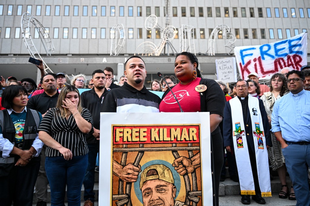 Salvadoran migrant and US resident Kilmar Abrego Garcia (center L) speaks, alongside Lydia Walther Rodríguez (R) of CASA, as he arrives at a US Immigration and Customs Enforcement (ICE) field office in Baltimore, Maryland, on August 25, 2025. Also pictured is Abrego Garcia's wife Jennifer Vasquez (second L). (Photo by ROBERTO SCHMIDT / AFP)