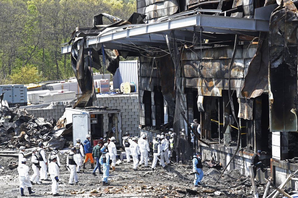 Police investigators enter to inspect a burnt construction site after a fire in Icheon. (AP photo) Police investigators enter to inspect a burnt construction site after a fire in Icheon. (AP photo)