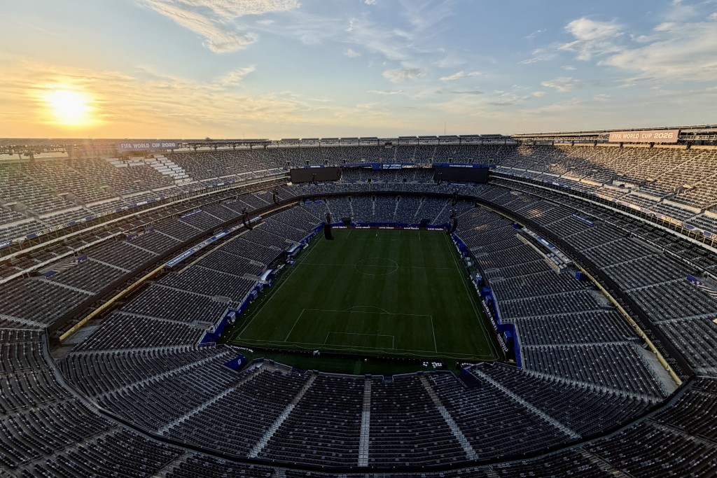 The sun sets in the distance as seen from New York New Jersey Stadium in East Rutherford, New Jersey, on June 12, 2026. (Photo by Daniel SLIM / AFP)