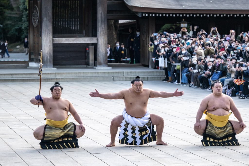Photo by PHILIP FONG / AFP  Mongolian born sumo wrestler and new yokozuna, or grand champion, Hoshoryu (C) performs the ring-entering ceremony at Meiji Shrine in Tokyo on January 31, 2025.