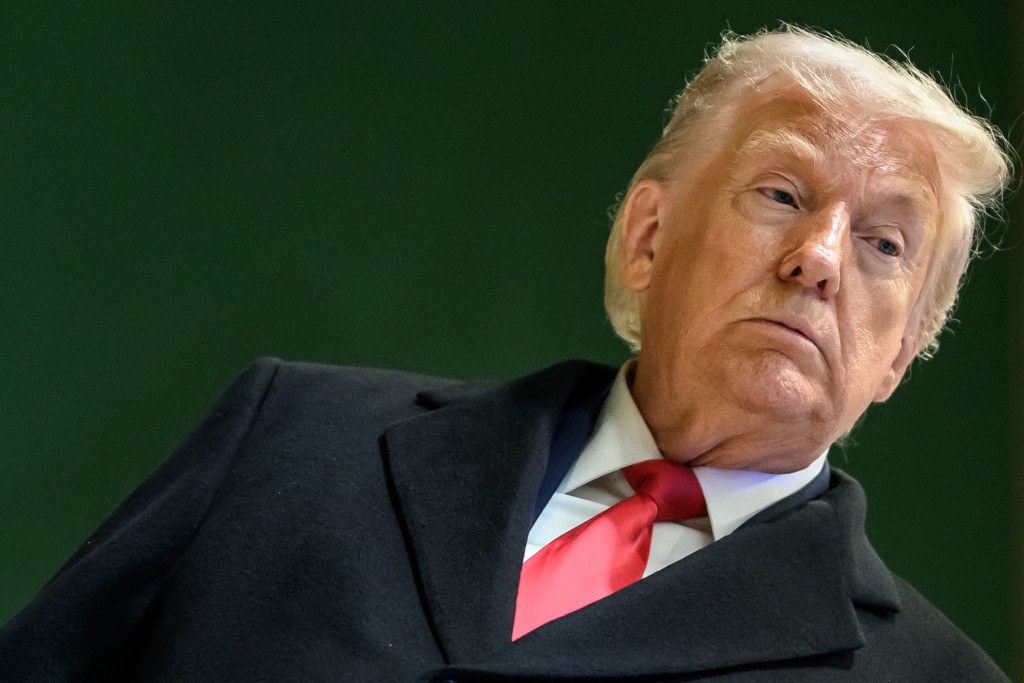 Photo by FABRICE COFFRINI / AFP  US President Donald Trump looks on as he leaves the congress centre during the World Economic Forum (WEF) annual meeting in Davos on January 21, 2026.