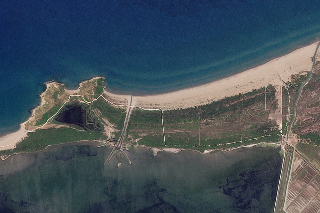 Photo by HANDOUT / 2026 PLANET LABS PBC / AFP  This handout satellite image taken on June 11, 2026 and released on July 21, 2026 by 2026 Planet Labs PBC shows a protected area on the coast of the Narta Lagoon, on the southwest coast of Albania near Vlora where the construction of a tourist complex linked to the Trump family is planned.