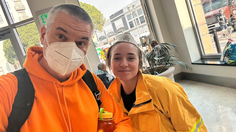Ryan Pearson, a Los Angeles-based entertainment video editor for The Associated Press, and his colleague Krysta Fauria take a selfie at an evacuation center at the Pasadena Convention Center in Pasadena, Calif., as they interview evacuees Wednesday, Jan. 8, 2025. (AP Photo/Ryan Pearson) Ryan Pearson, a Los Angeles-based entertainment video editor for The Associated Press, and his colleague Krysta Fauria take a selfie at an evacuation center at the Pasadena Convention Center in Pasadena, Calif., as they interview evacuees Wednesday, Jan. 8, 2025. (AP Photo/Ryan Pearson)