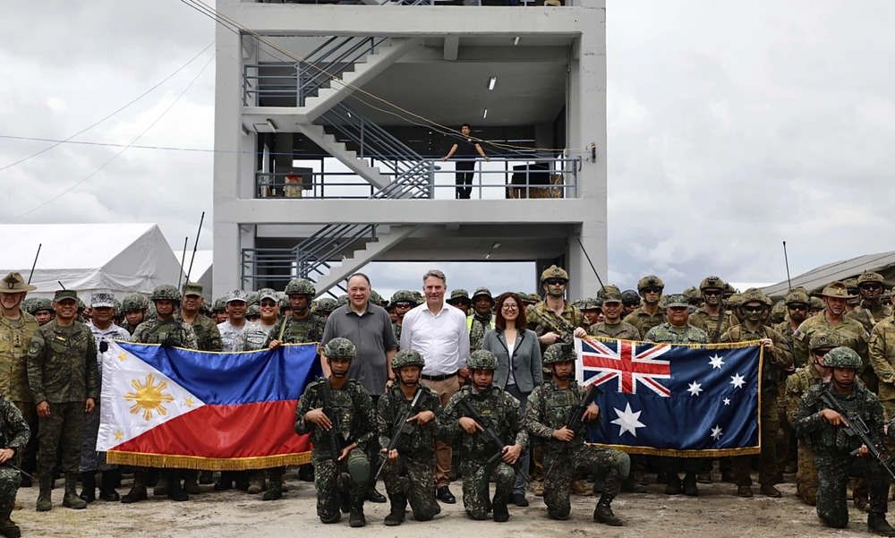 Australian and Filipino forces, backed by U.S. Marines, practiced retaking an island seized by hostile forces in a large military drill Friday. (AP) Australian and Filipino forces, backed by U.S. Marines, practiced retaking an island seized by hostile forces in a large military drill Friday. (AP)