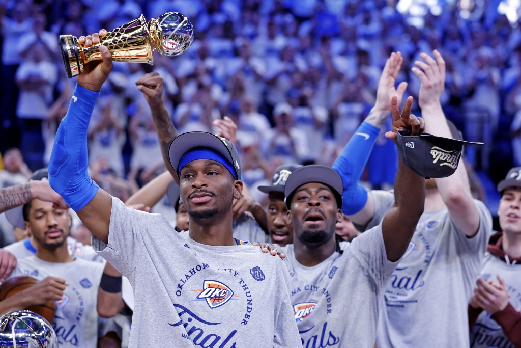 Oklahoma City Thunder guard Shai Gilgeous-Alexander (2) celebrates with Magic Johnson West Conference Finals MVP trophy after defeating the Minnesota Timberwolves in game five to win the western conference finals for the 2025 NBA Playoffs. (Reuters)