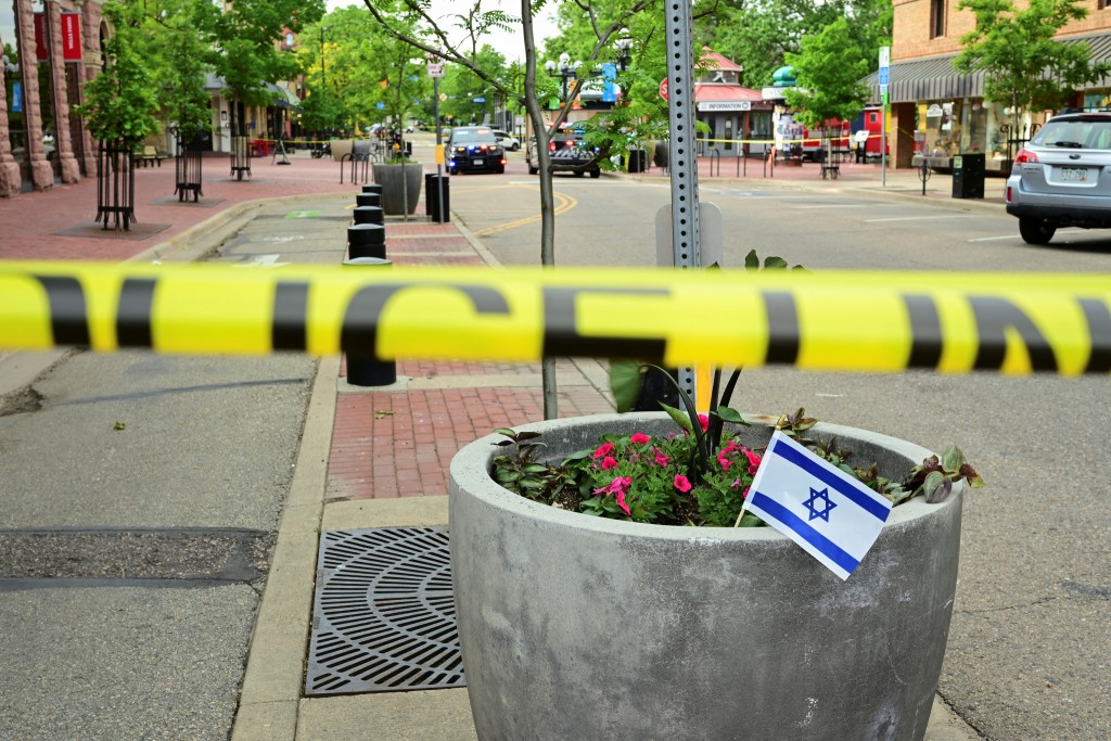An Israeli flag is placed near police tape, after an attack that injured multiple people, in Boulder, Colorado, U.S. June 1, 2025. (Reuters)