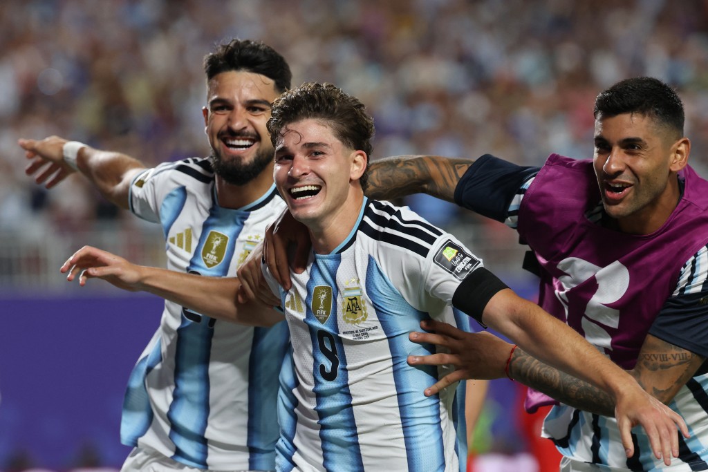 Aregentina's forward #09 Julian Alvarez (C) celebrates scoring his team's second goal (AFP)