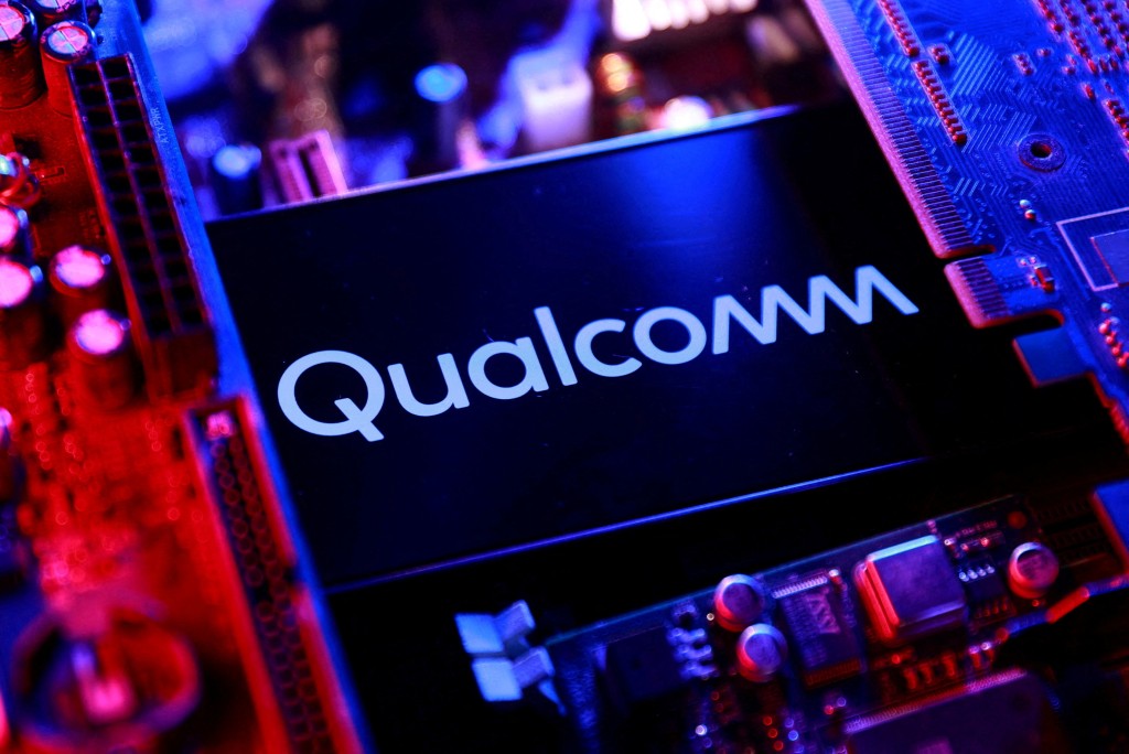 A Qualcomm logo and a computer motherboard appear in this illustration created on August 25, 2025. REUTERS/Dado Ruvic/Illustration/File Photo
