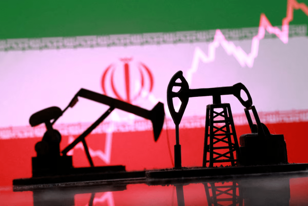 3D-printed oil pump jacks, Iranian flag, and a rising stock graph appear in this illustration taken March 2, 2026. REUTERS/Dado Ruvic/Illustration/File Photo 