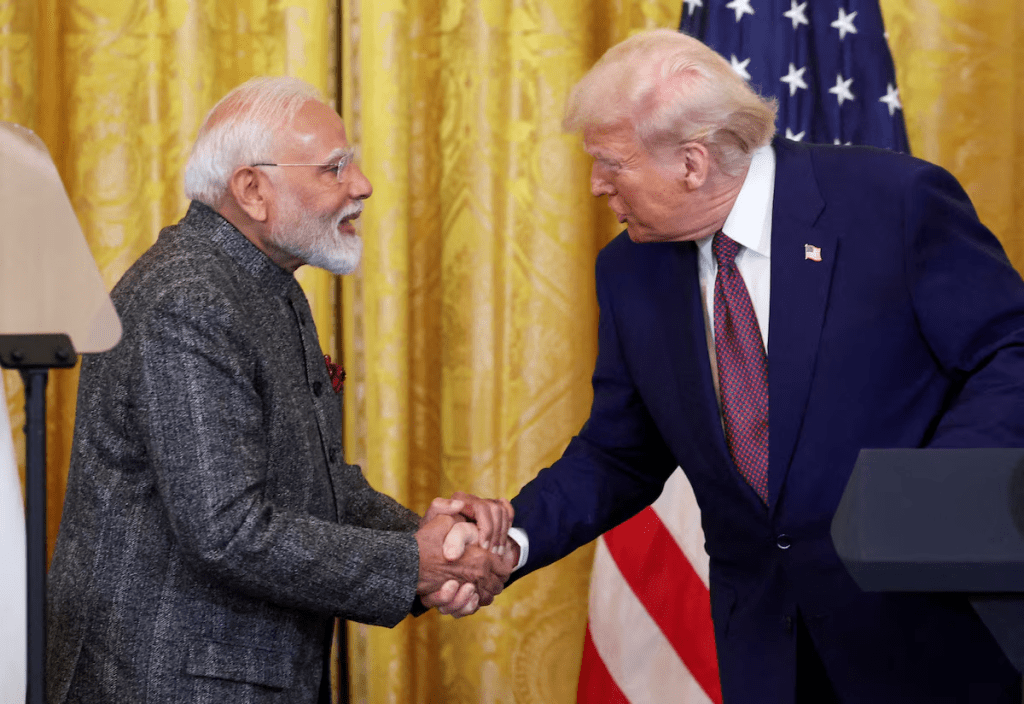 U.S. President Donald Trump and Indian Prime Minister Narendra Modi shake hands as they attend a joint press conference at the White House in Washington, D.C., U.S., February 13, 2025. REUTERS/Kevin Lamarque/File
