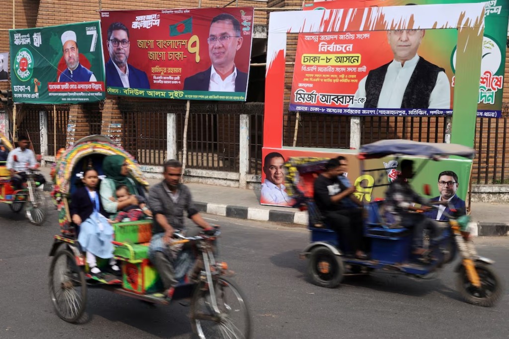 Vehicles pass by election campaign banners ahead of the national election, in Dhaka, Bangladesh, February 10, 2026. REUTERS/Mohammad Ponir Hossain/File Photo
