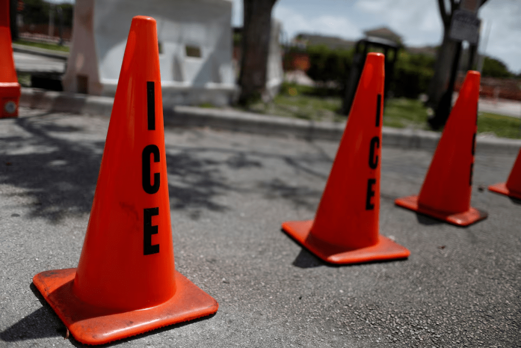 range traffic cones with the word "ICE" are seen at Immigration and Customs Enforcement (ICE) facilities in Miramar, near Miami, Florida, U.S. July 14, 2019. REUTERS/Marco Bello/File Photo