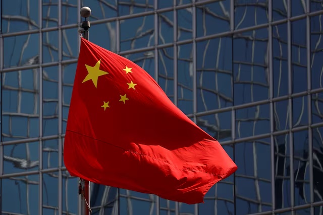 The Chinese national flag is seen in Beijing, China April 29, 2020. REUTERS/Thomas Peter/File Photo
