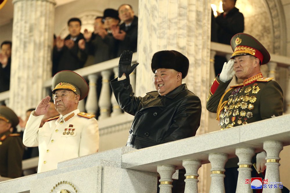 In this photo provided by the North Korean government, North Korean leader Kim Jong Un waves as Kim attended a military parade, marking the ruling party congress, at Kim Il Sung Square in Pyongyang, North Korea Thursday.