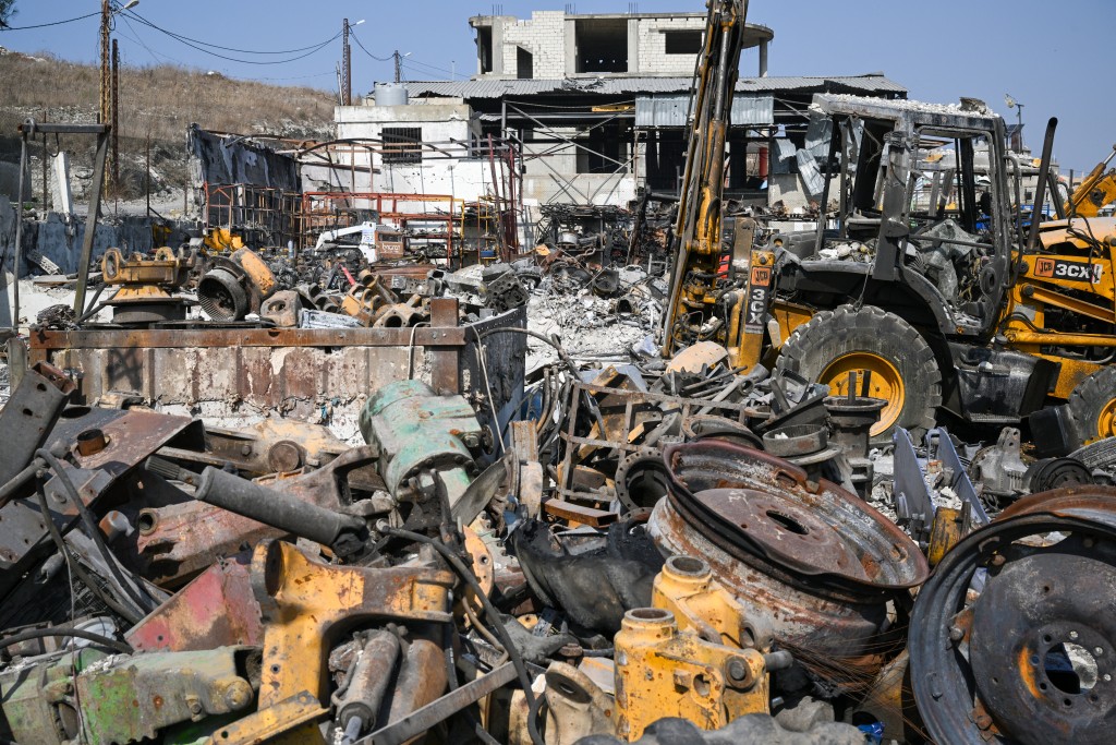 Photo by JOSEPH EID / AFP This photo taken on November 6, 2025 shows burned construction vehicles at a site that was targeted in an Israeli strike in the southern Lebanese village of Ansaryeh.