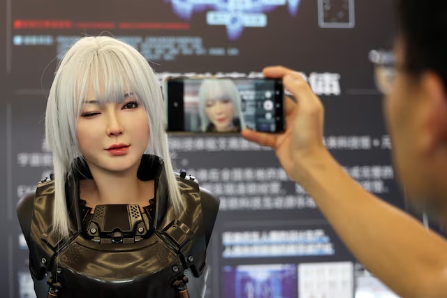 A humanoid robot developed by Ex-Robots winks at the World Robot Conference in Beijing, China. (Reuters) A humanoid robot developed by Ex-Robots winks at the World Robot Conference in Beijing, China. (Reuters)