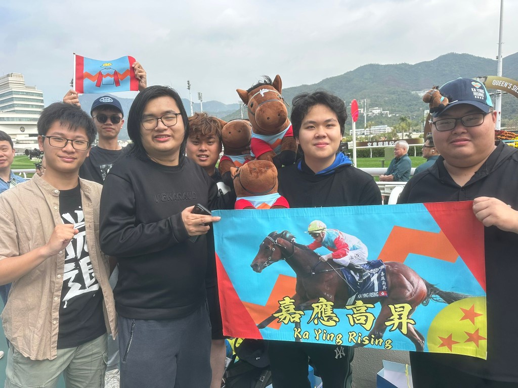 Hong Kong racing super fans including Martin Yan, right, from Shanghai.