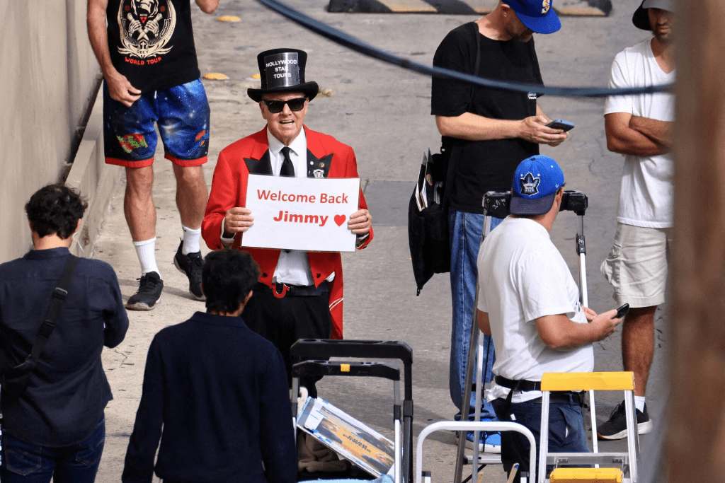 Gregg Donavan holds a sign that reads "Welcome back Jimmy" outside the theatre where "Jimmy Kimmel Live!" was recorded for broadcast, the day after Disney announced that the show would return to its ABC network lineup following Kimmel’s temporary suspension for his remarks about Charlie Kirk, in Los Angeles, California, U.S. September 23, 2025. REUTERS/David Swanson