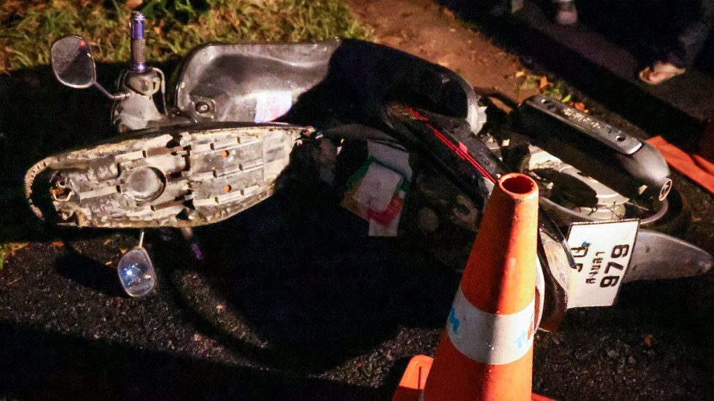 A motorbike near the gate of the Patongprathankiriwat School, which, according to police, is believed to belong to the gunman. Reuters
