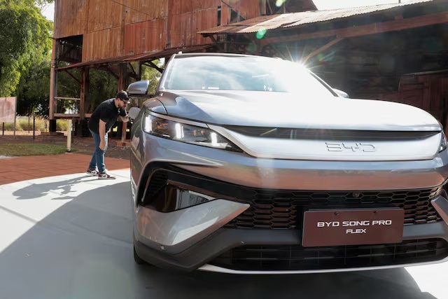 A person looks at a BYD Song Pro Flex vehicle during the launch of the Chinese automaker's first Brazilian-made plug-in hybrid flex-fuel car at the Museu da Cana in Sertaozinho, Sao Paulo state, Brazil, August 4, 2026. REUTERS/Joel Silva/File Photo