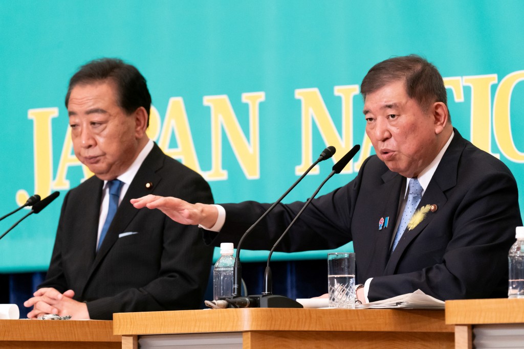 Democratic Party of Japan President Yoshihiko Noda listens as Japan's Prime Minister and Liberal Democratic Party President Shigeru Ishiba speaks during a debate with leaders of other political parties at the Japan National Press Club in Tokyo, Japan, July 2, 2025.