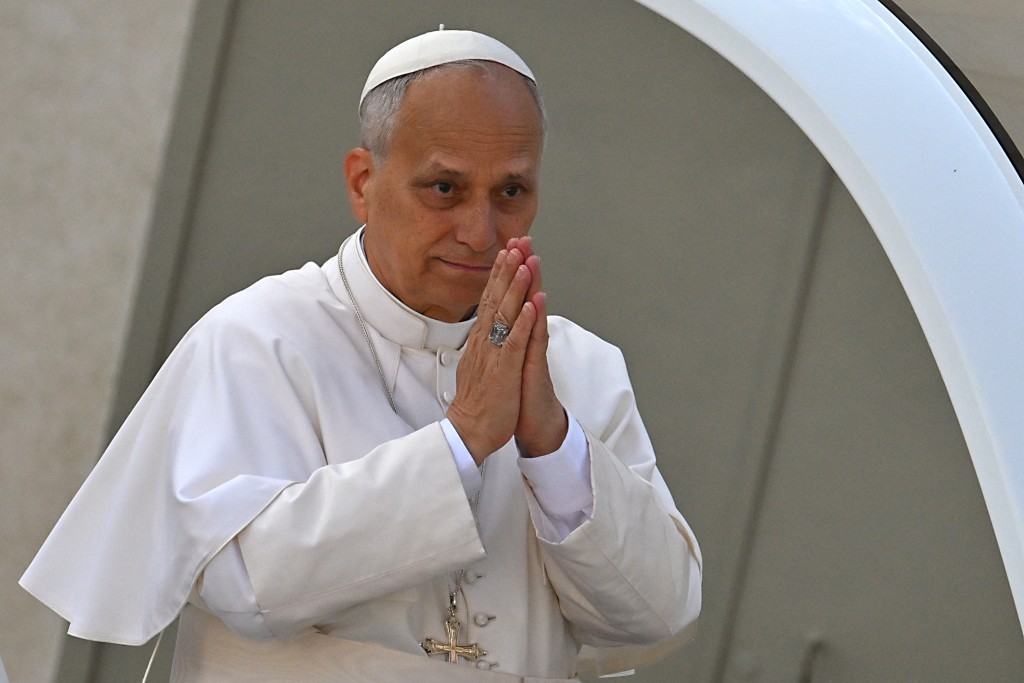 Pope Leo XIV gestures to faithfull from the popemobile as he leaves St. Peter's Square at the Vatican after the Jubilee Mass for the missionary world and migrants, on October 5, 2025. (AFP)