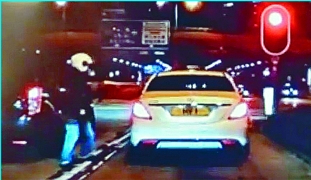The victim, nicknamed 'Crazy Yung,' drove himself 1.6 kilometers to Queen Elizabeth Hospital – crashing into three taxis – after being shot in the chest when his Mercedes Benz was stopped at traffic lights in Tsim Sha Tsui, captured on a dashcam of a