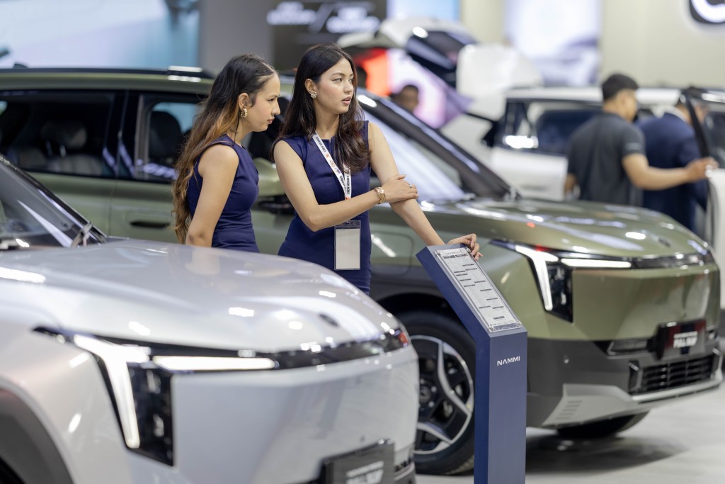 KATHMANDU, Aug. 26, 2026 (Xinhua) -- Vehicles are pictured with promotional models at the booth of Chinese automaker Dongfeng during the 18th NADA Auto Show in Kathmandu, Nepal, Aug. 25, 2026. Nepal's 18th NADA Auto Show kicked off here on Tuesday, bringing together more than 50 vehicle brands. Organized by the NADA Automobiles Association of Nepal, the five-day exhibition features around 200 stalls displaying four-wheelers, two-wheelers, auto parts and related services. (Photo by Sulav Shrestha/Xinhua)